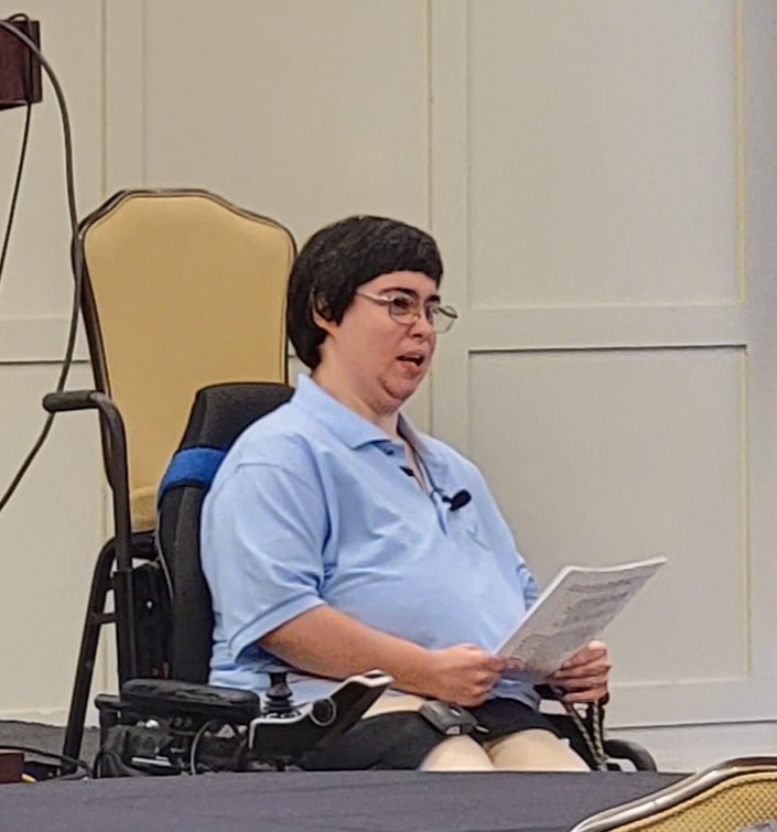 Katie speaking in front of a crowd at Union Station in 2022.
